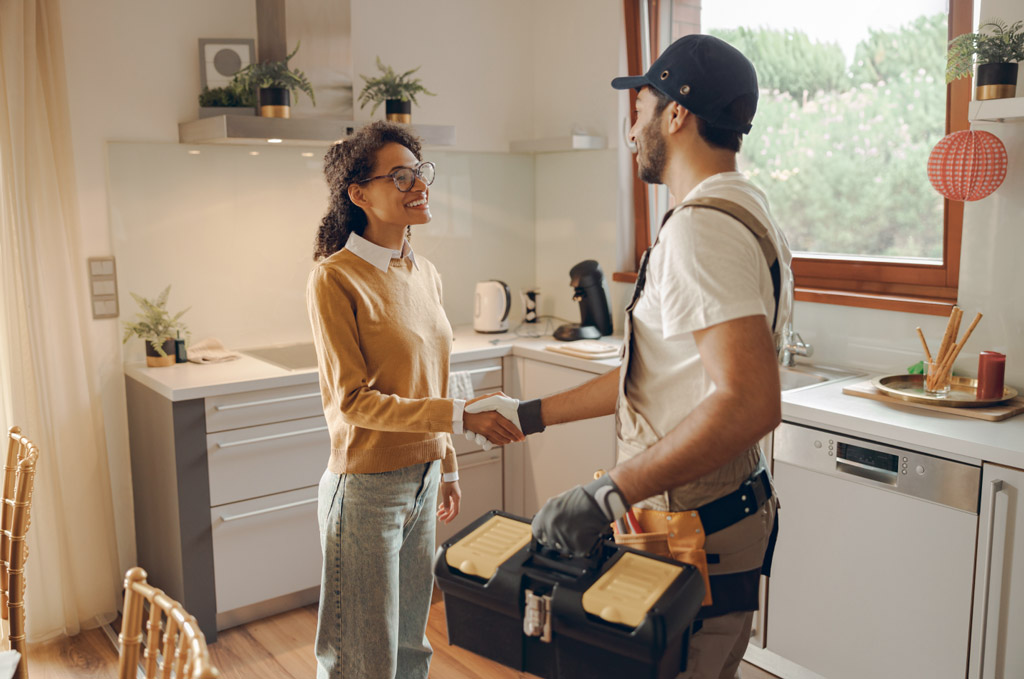 Woman shaking hands with service man